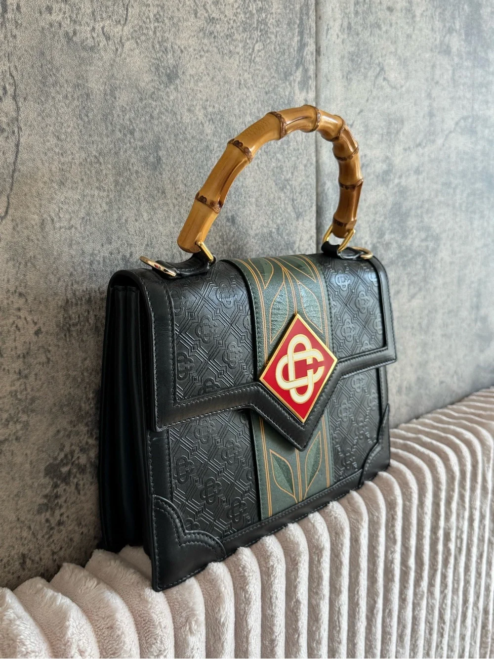 Black Satchel with Bamboo Top Handle and Green-Gold Stripe Accent